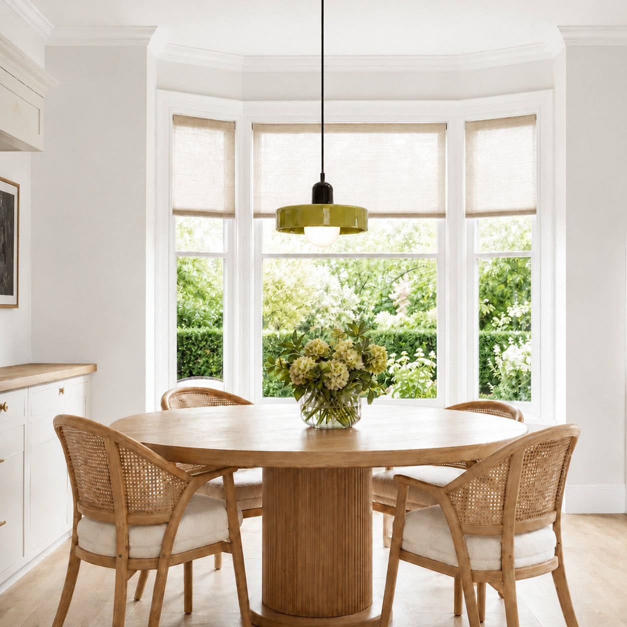 Pendant over a round wood dining table