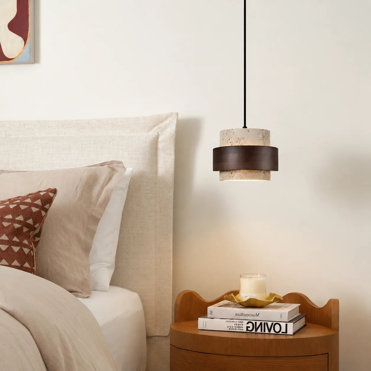 Pendant beside a bedroom headboard