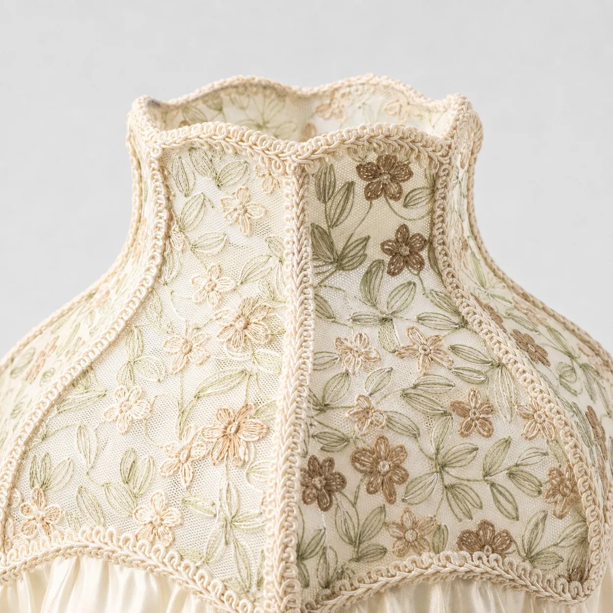 Floral embroidery and braided shade trim detail