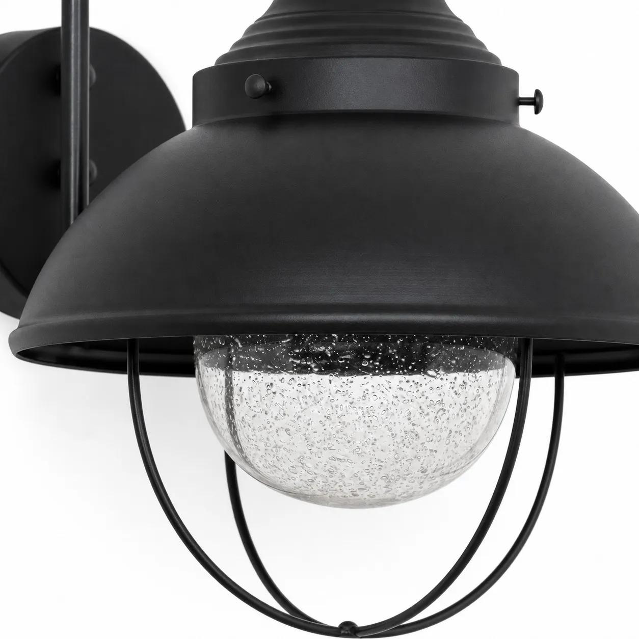 Seeded-glass globe beneath a black metal shade and cage