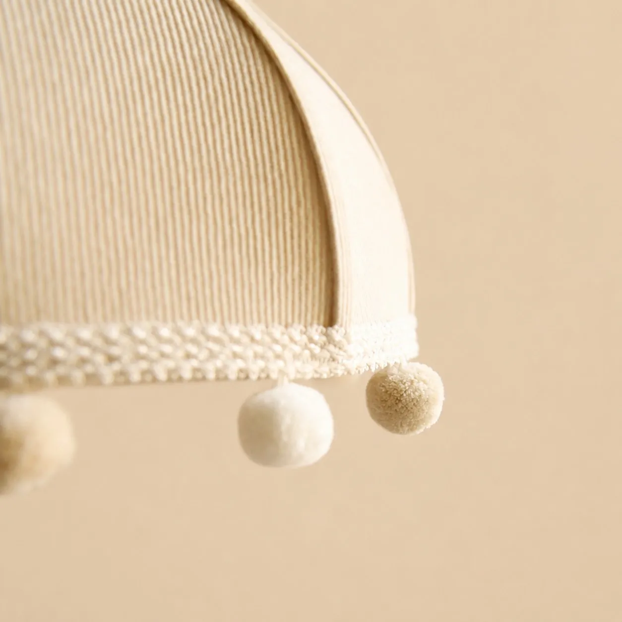 Milk White ribbed fabric and pom-pom trim detail